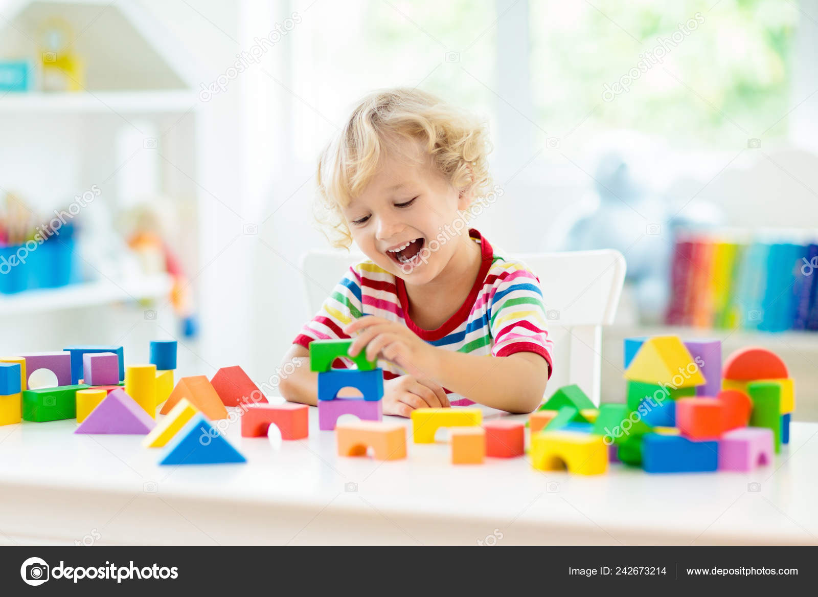 kid playing blocks