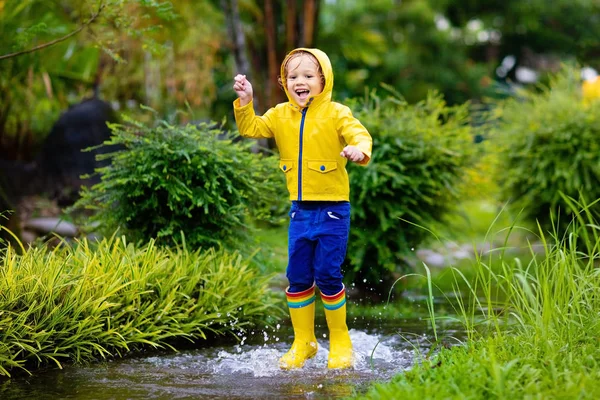 Kid Playing Rain Autumn Park Child Jumping Muddy Puddle Rainy — Stock Photo, Image