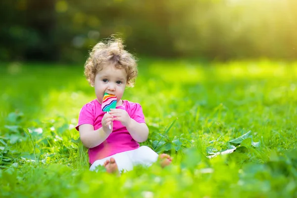 Baby Girl Eating Ice Cream Candy Sunny Park Child Lollipop — Stock Photo, Image