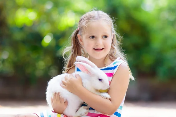 Child with rabbit. Easter bunny. Kids and pets. — Stock Photo, Image