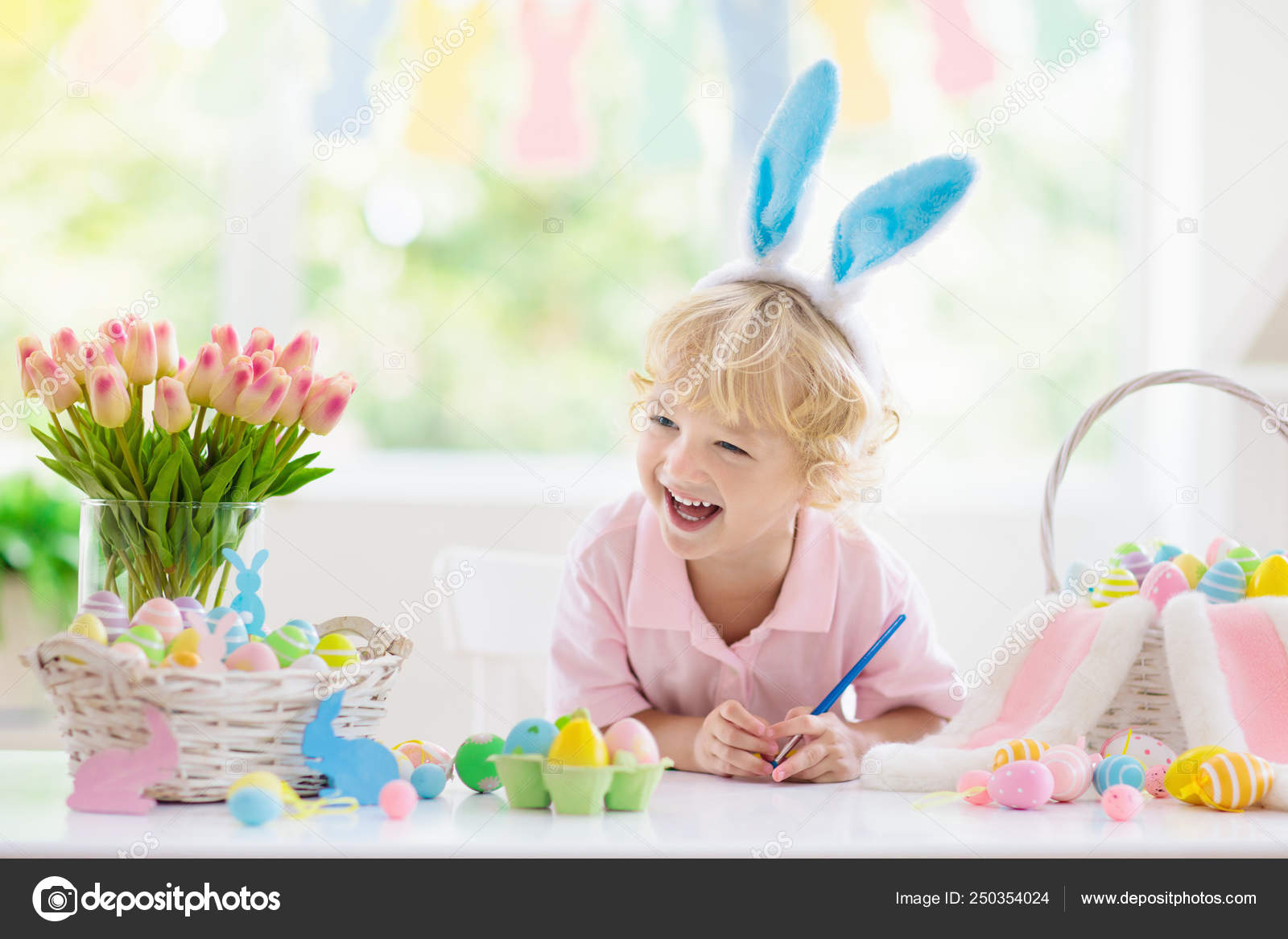 Kids on Easter egg hunt. Children dye eggs. Stock Photo by ©FamVeldman