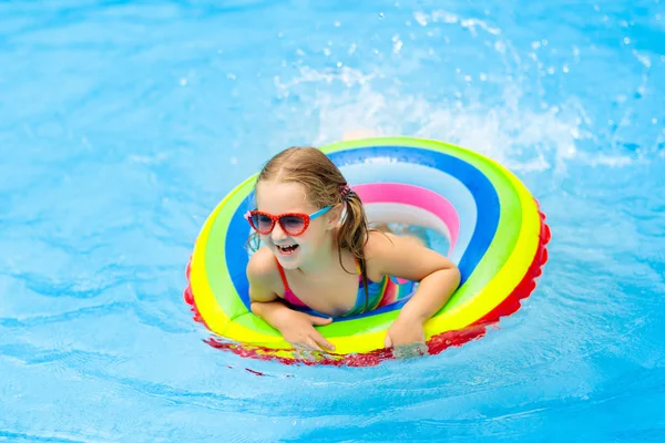 Child in swimming pool on toy ring. Kids swim. — Stock Photo, Image