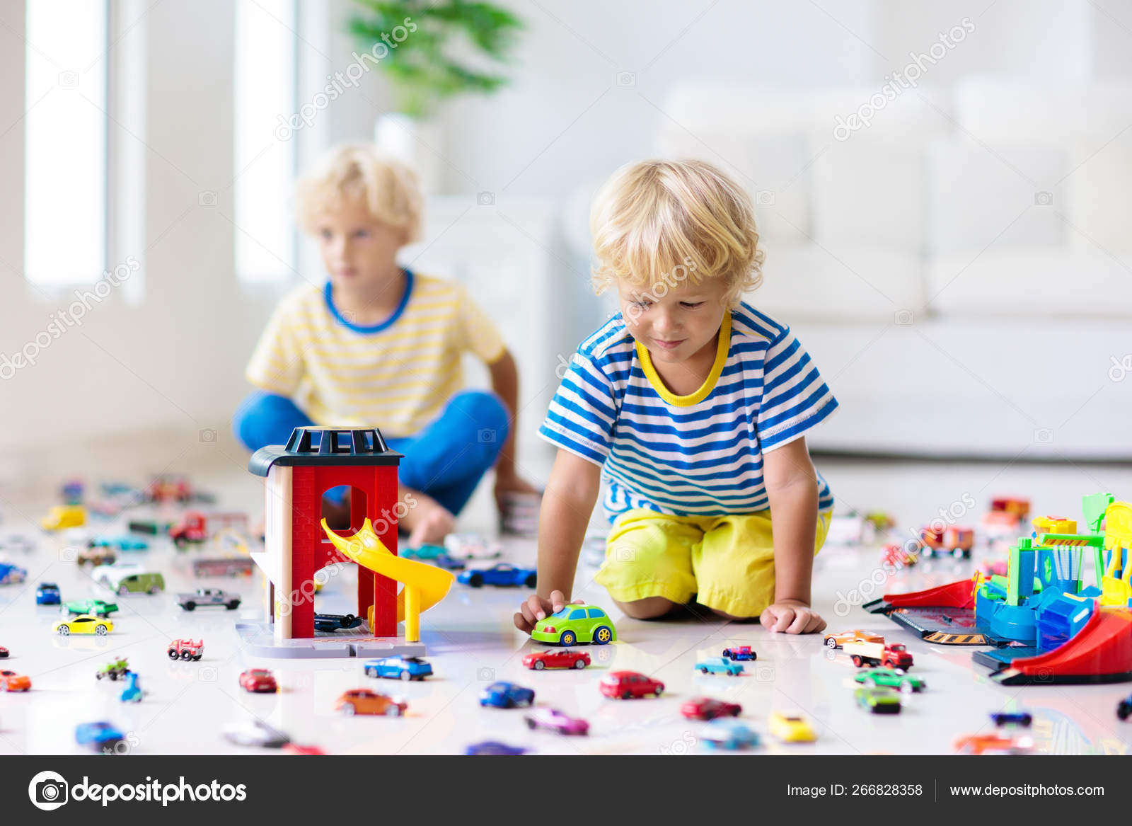 child playing with toy car