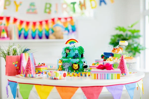 Kids birthday cake. Child jungle theme party.