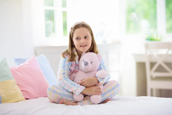 Child playing in bed. Kids room. Girl at home. — Stock Photo, Image