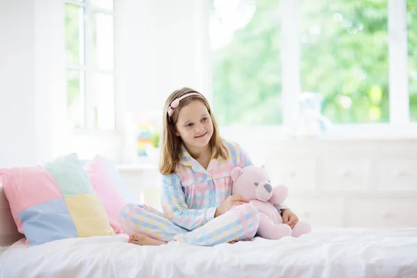 Child playing in bed. Kids room. Girl at home. — Stock Photo, Image
