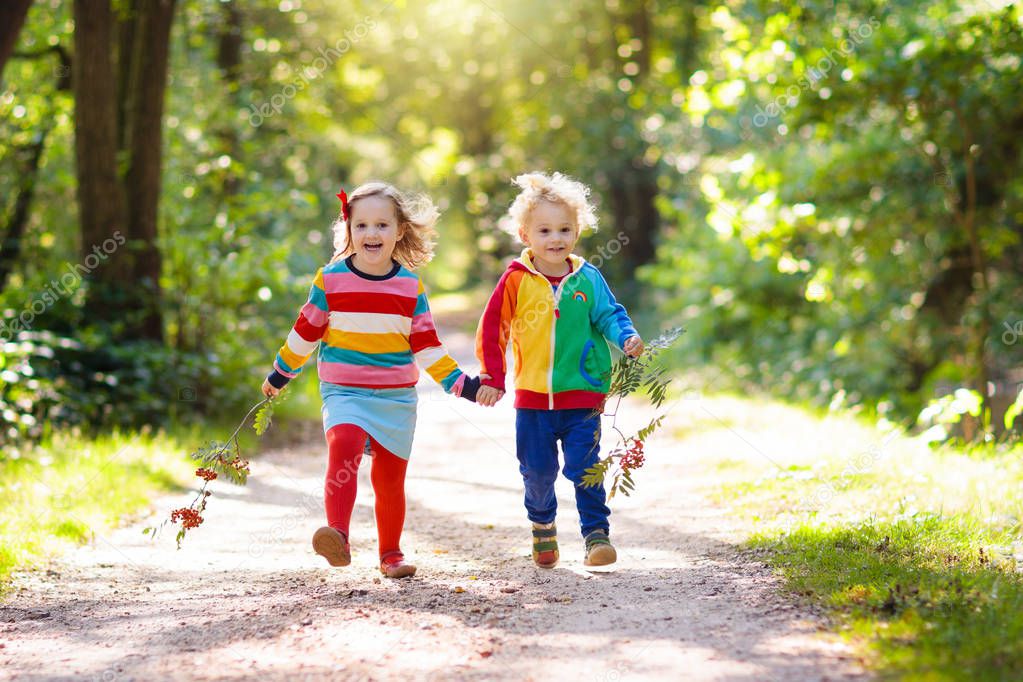 Kids play in autumn park