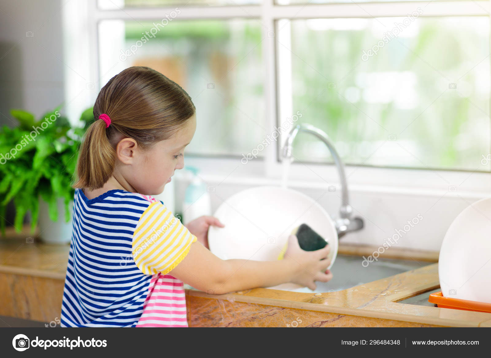 child-washing-dishes-stock-photo-by-famveldman-296484348