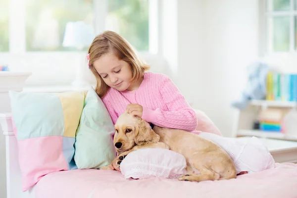 Child playing with dog. Kids play with puppy. — Stock Photo, Image