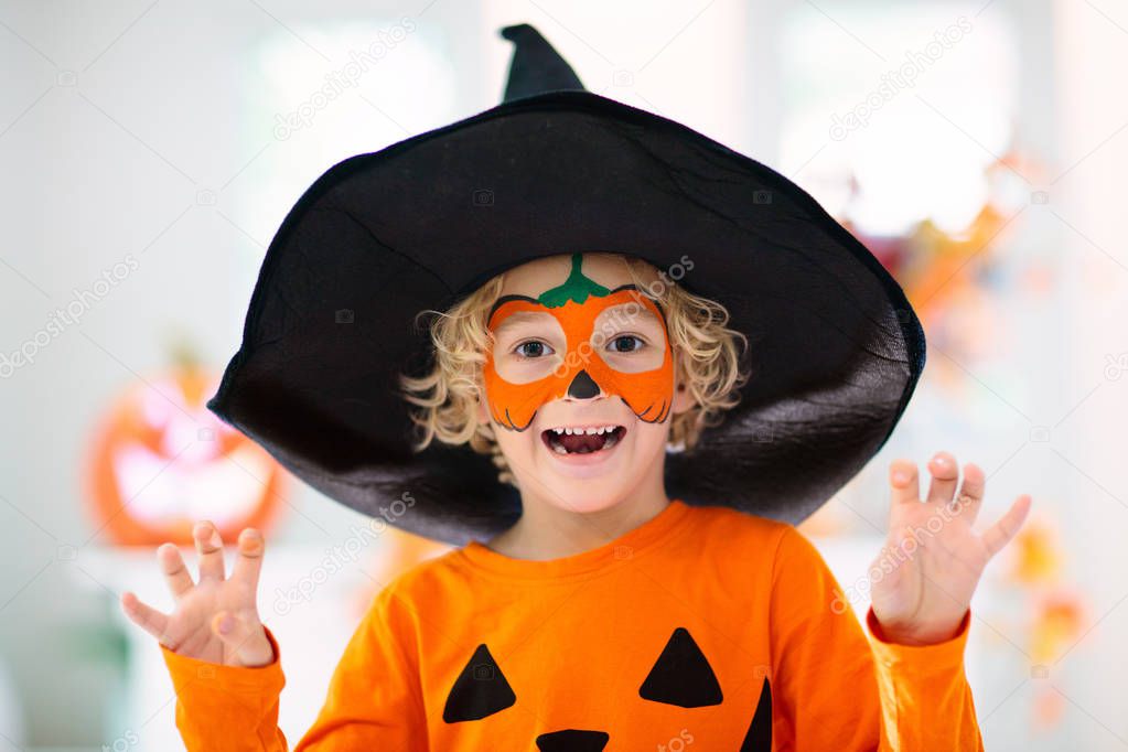 Child in Halloween costume. Kids trick or treat.