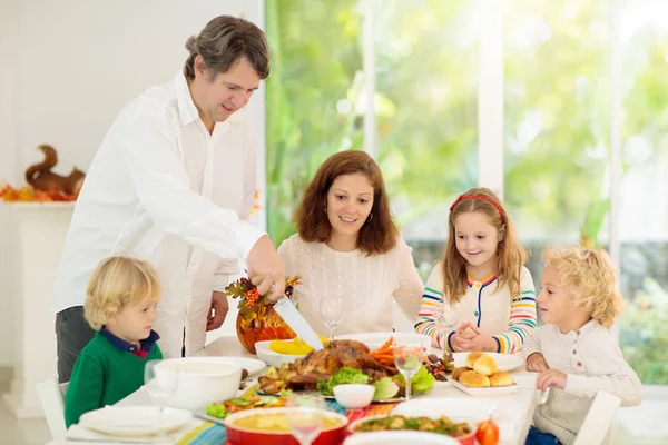 Family with kids at Thanksgiving dinner. Turkey. — Stock Photo, Image