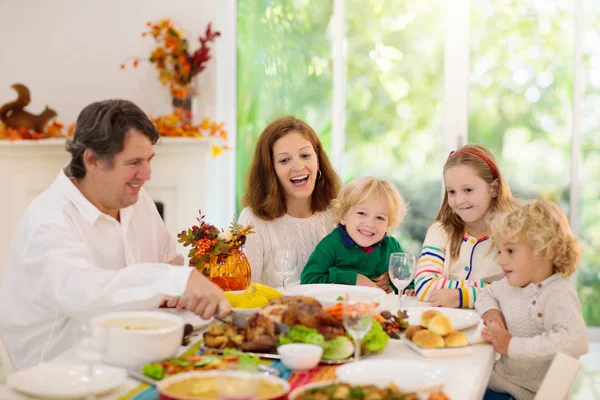 Family with kids at Thanksgiving dinner. Turkey. — Stock Photo, Image
