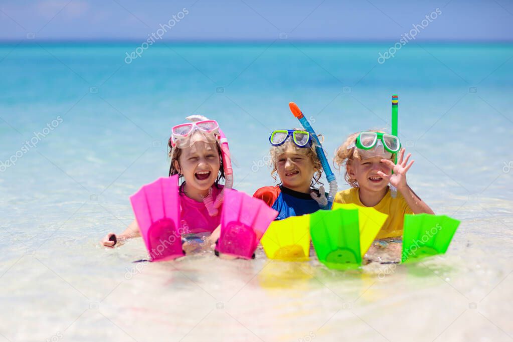 Kids snorkel. Beach fun. Children snorkeling in tropical sea on family summer vacation on exotic island. Child with mask and fins. Travel with kid. Little boy and girl learning to dive. Diving holiday