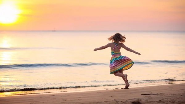 Child Playing Ocean Beach Kid Jumping Waves Sunset Sea Vacation — Stock Photo, Image