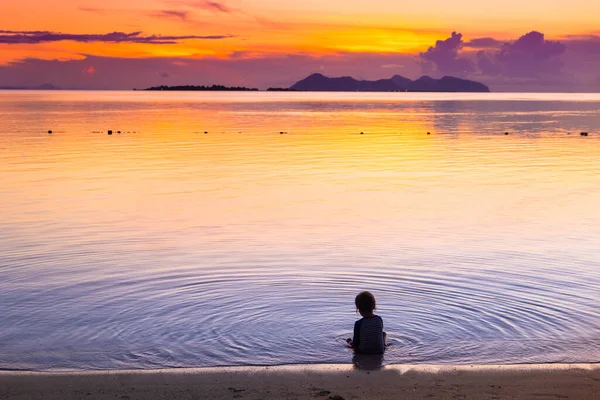 Child Playing Ocean Beach Kid Jumping Waves Sunset Sea Vacation — Stock Photo, Image