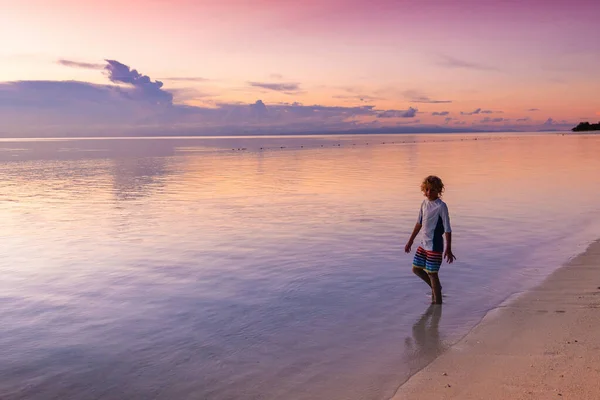 Child Playing Ocean Beach Kid Jumping Waves Sunset Sea Vacation — Stock Photo, Image