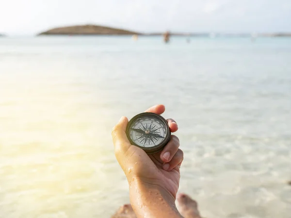 Woman Hand Holds Compass Beach — стоковое фото