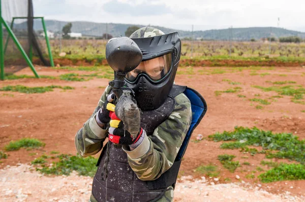 Kid is ready to play a paintball game