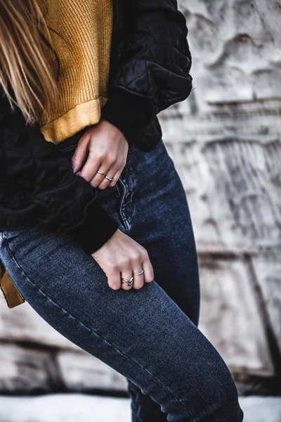 Knee figure of young beautiful blonde straight hair woman in the city, one hand in pocket - eyes closed - serenity, carefreeness concept - wearing jeans overalls and jacket — Stock Photo, Image