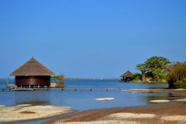 Beautiful relaxing remote water bungalows, Les Collines de Niassam, Senegal clipart