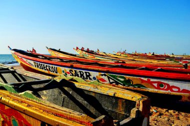 Traditional wooden boat in Palmarin, Senegal clipart