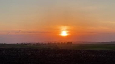Splendid sunset over the peaceful landscape in the countryside