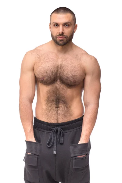 Beyaz arka plan fitness modeli sağlık yaşam üstsüz vücut güçlü kollarıyla Studio'yu acımasız kaslı adam