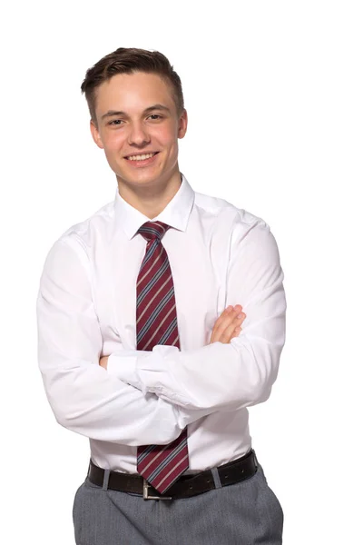 Un joven guapo y seguro de sí mismo de pie y sonriendo con una camisa blanca aislada en blanco . —  Fotos de Stock