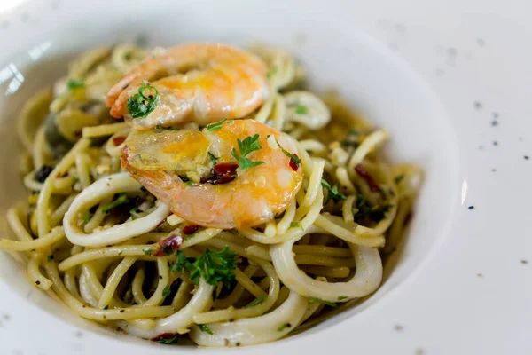 Spaghetti aglio e olio. Spaghetti pasta with garlic, shrimps and olive oil.