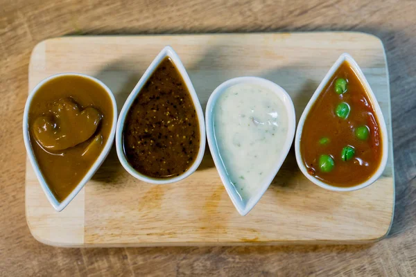 Mushroom sauce, black pepper sauce, tartar sauce and sweet spicy sauce.