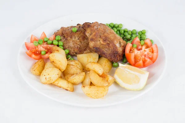 Fried Beef Steak Served Fried Potatoes Tomatoes Peas Slices Lemon — Stock Photo, Image