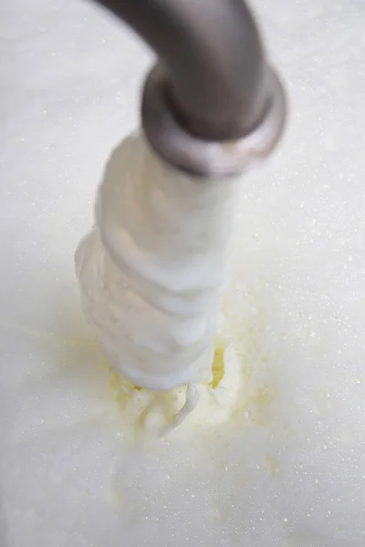 Process Of Filling The Milk Storage Tank In Modern Dairy Closeup