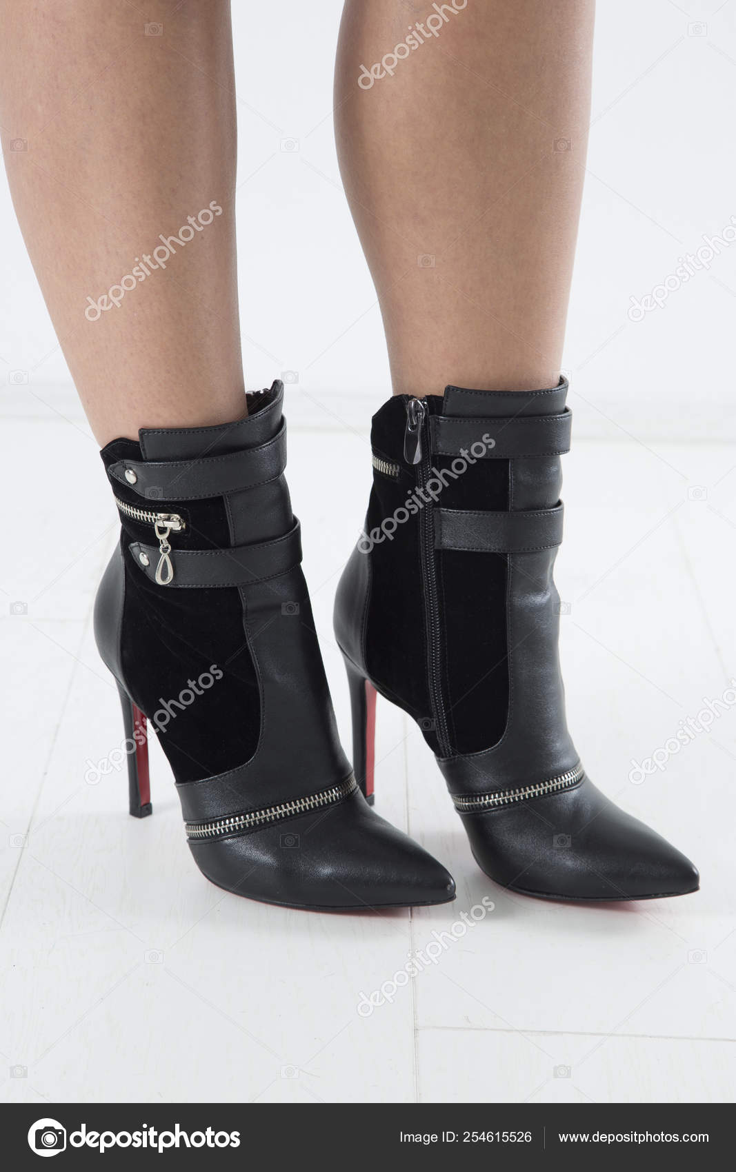 Side View Elegant Black Leather High Heels Pointed Boots Straps Stock Photo  by ©likstudio 254615526