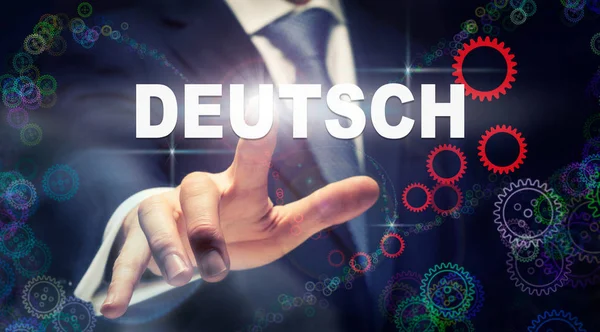 Businessman Pressing German Deutsch Button German Language Futuristic Computer Display — Stock Photo, Image