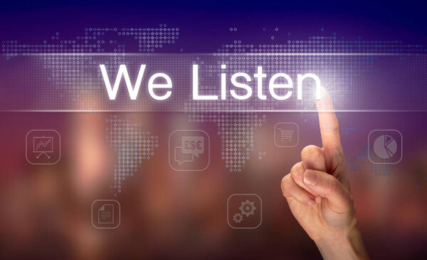 Male hand selecting we listen button on clear screen with blurred background