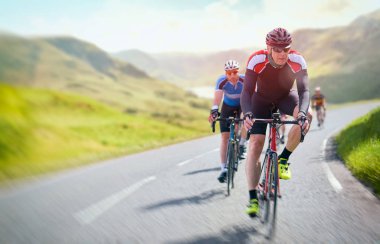 Cyclists out racing along country lanes clipart