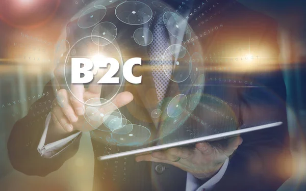 En hand som väljer en B2C affärsidé på en futuristisk dator — Stockfoto