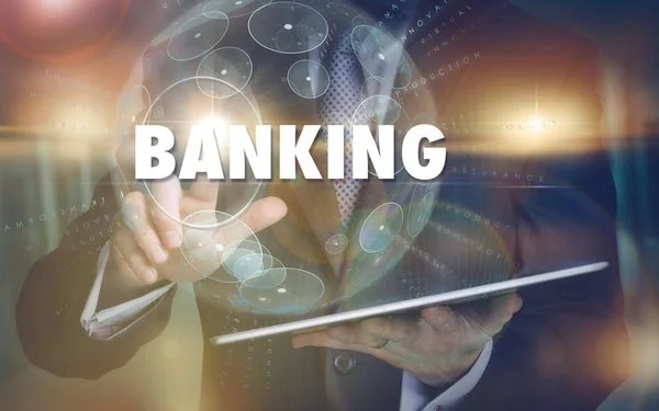 Uma mão selecionando um conceito de negócio bancário em uma comp futurista — Fotografia de Stock