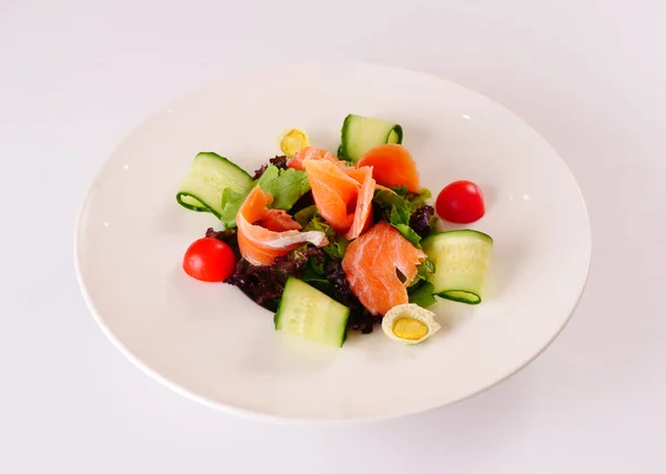 Salmon Salad with Truffle Ponzu. Vegetable salad with red fish. White background