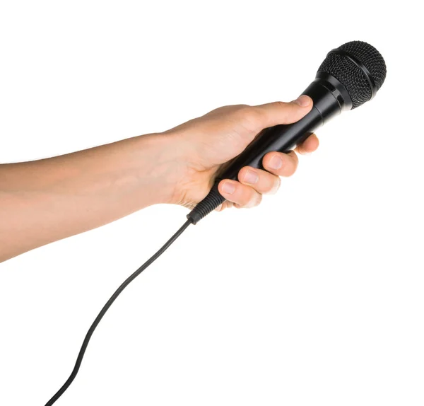 Handen håller mikrofonen isolerad på vita urklippsbana — Stockfoto