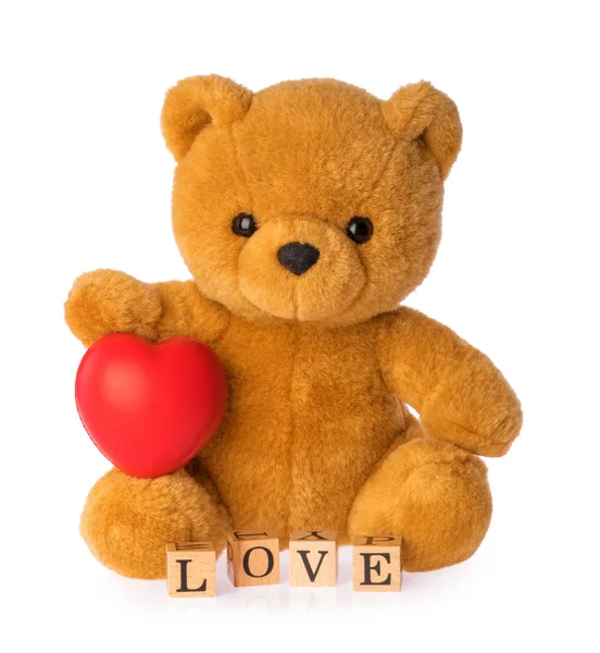 Teddybär mit Herz-Liebe-Konzept auf weißem Hintergrund — Stockfoto