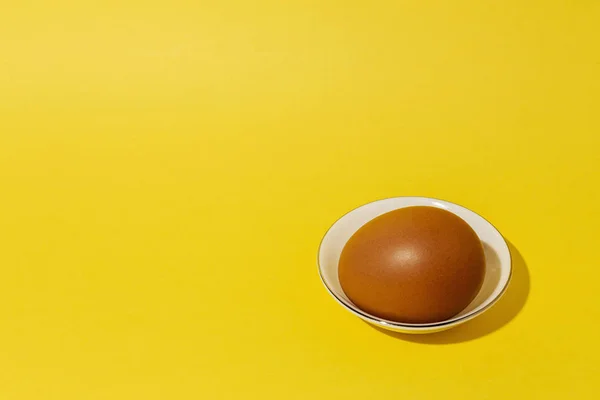 Fresh raw eggs on yellow background — Stock Photo, Image