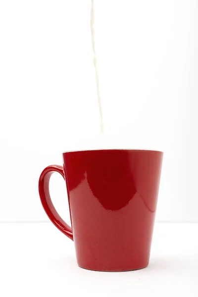 Fresh milk in colored cups — Stock Photo, Image