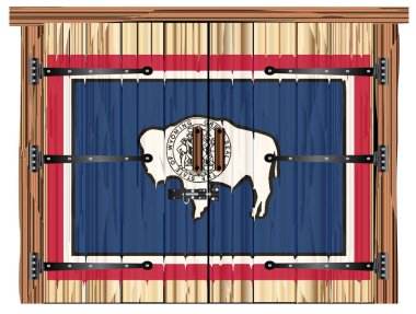 Kapalı ahşap bir ahır. Sürgülü, menteşeli ve Wyoming bayrağı üzerine boyanmış.