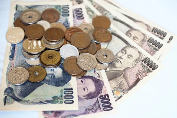 Japanese yen notes and Japanese yen coins for money concept background