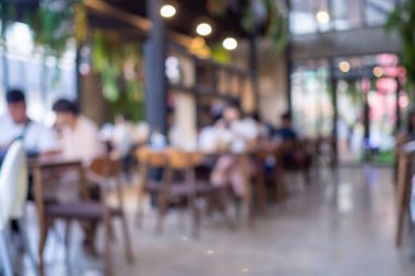 Bulanık kahve ve müşterilerin arka plan vintage ton renk tarzına sahip dinlendirici kafe.