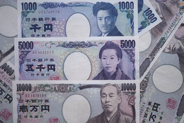 Japanese yen notes and Japanese yen coins for money concept background