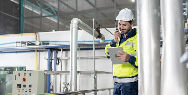 Mechanic or maintenance or electrical engineer checking main electrical control systems industrial plant. Utility fore man daily check power systems in process. Main Distribution Board, Switchboards