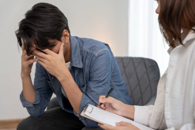 man with mental health problems is consulting. psychiatrist is recording the patient's condition for treatment. encouragement, love and family problem, bipolar , depression patient, protect suicide