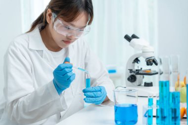 Scientist check chemical food residues in laboratory. Control experts inspect quality of fruits, vegetables. lab, hazards, ROHs, find prohibited substances, contaminate, Microscope, Microbiologist